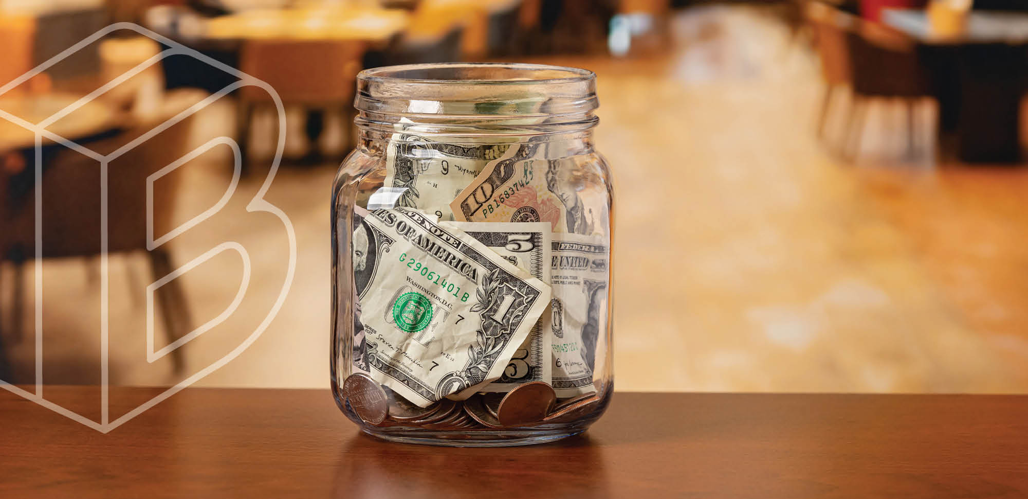 Image of a tip jar with money inside